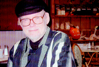 [Photograph: James Mechem at
breakfast the morning of his 80th birthday, Oct. 31, 2003. Photograph by
Denise Low.