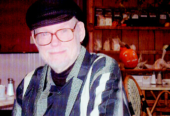 [Photograph: James Mechem at
breakfast the morning of his 80th birthday, Oct. 31, 2003. Photograph by
Denise Low.