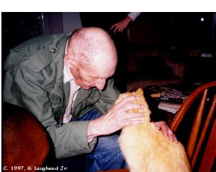 [photo: Beat writer William S.
Burroughs photographed at home with cat Ginger, April 1997, Lawrence, KS.
Copyright 1997, George Laughead]