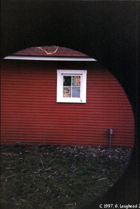 View from Beat writer William Burroughs' orgone box with
Burroughs' art on garage windows. Copyright 1997, George Laughead Jr.