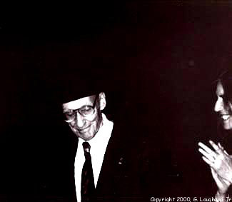 [Beat Generation photo image: Beatnik William Burroughs with rocker Patti Smith, receiving an ovation at Nova Convention Revisited, November 26, 1996, Lawrence. It was Burroughs last public event. Copyright 2000, G. Laughead ]